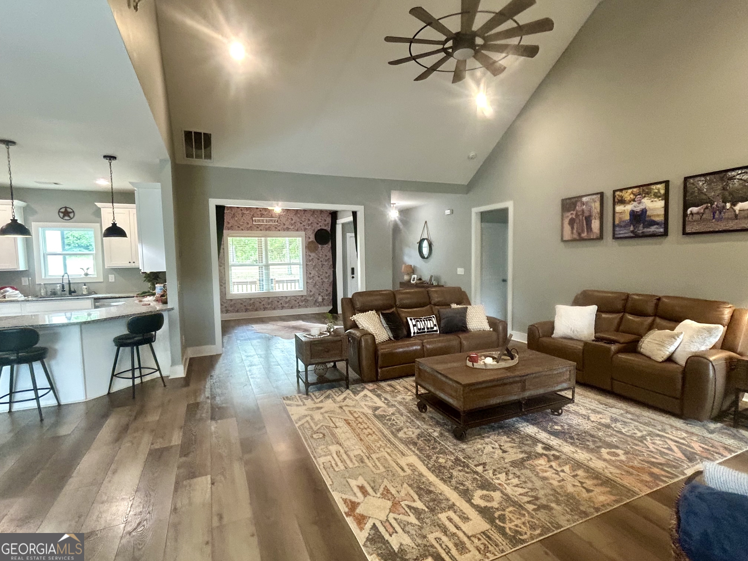 1250 Godfrey Road Madison, GA 30650 - Photo 20 of 42 a living room with furniture and a wooden floor
