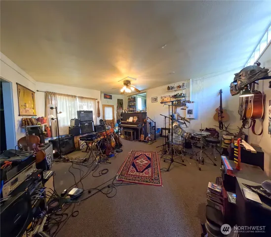 a living room with lots of gym equipment