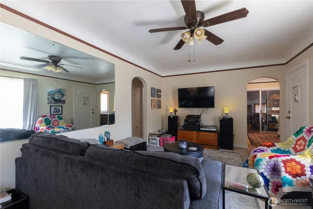 a living room with furniture and a flat screen tv