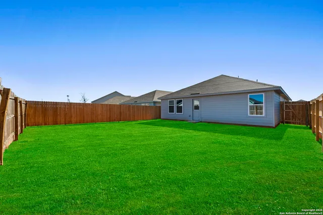 a view of a back yard with an outdoor space