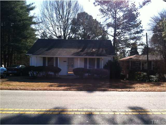 1108 Ridge Road Roxboro, NC 27573 - Photo 1 of 9 a front view of a house with a yard and a garage