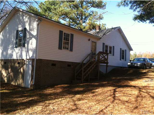 1108 Ridge Road Roxboro, NC 27573 - Photo 2 of 9 a view of a house with a yard