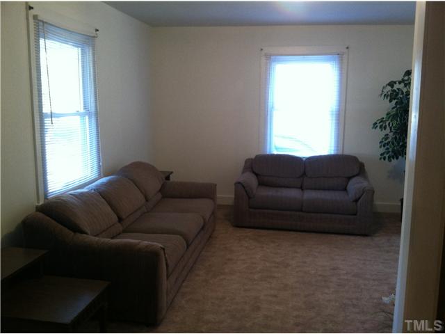 1108 Ridge Road Roxboro, NC 27573 - Photo 4 of 9 a living room with furniture and a window