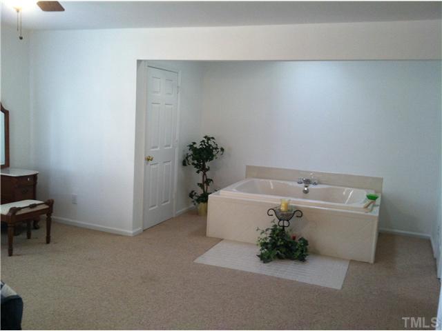 1108 Ridge Road Roxboro, NC 27573 - Photo 7 of 9 a white bath tub sitting in a bathroom