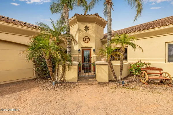 a kitchen with a table and chairs