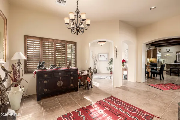 a living room with granite countertop a couch and a large window