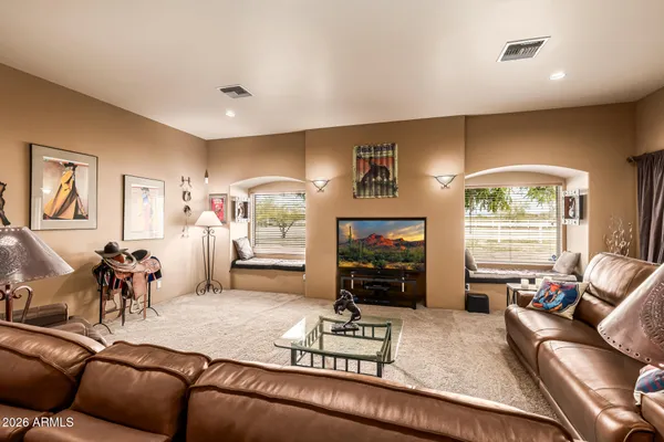 a shelf with books and knick knacks on it