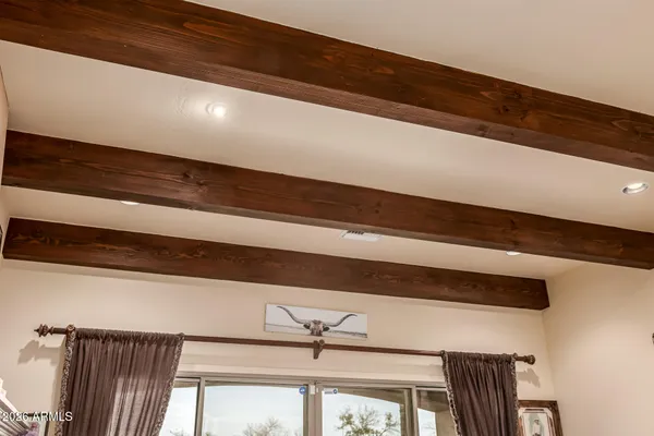 a white toilet sitting next to a bathroom sink and vanity