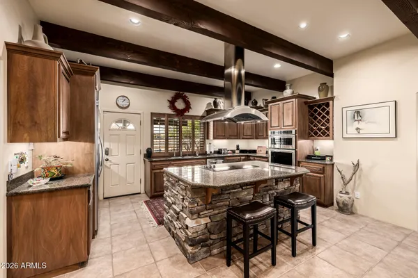 a bedroom with bed and a couch