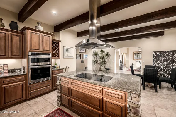 a bedroom with furniture and a large window