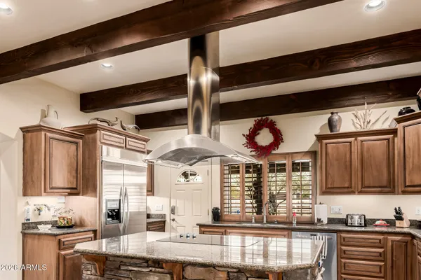 a bathroom with double vanity and a mirror