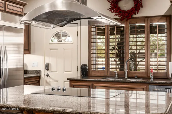 a bathroom with a toilet a sink and a mirror