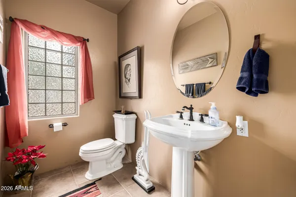 a view of a porch with furniture and a yard