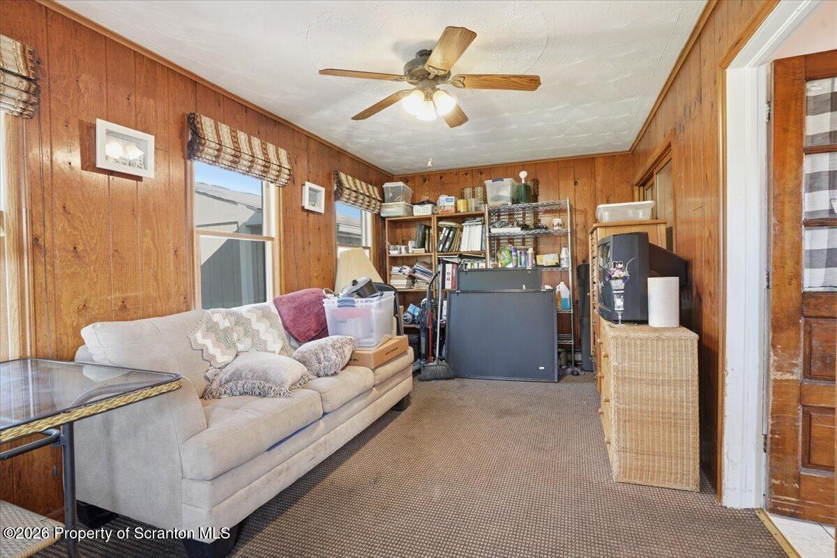 101 Stone Street Moosic, PA 18507 - Photo 28 of 53 a living room with furniture and a chandelier