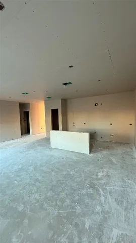 a view of empty room with a fireplace