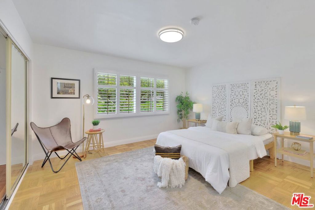 5372 Village Los Angeles, CA 90016 - Photo 11 of 28 a bedroom with a bed chair and window