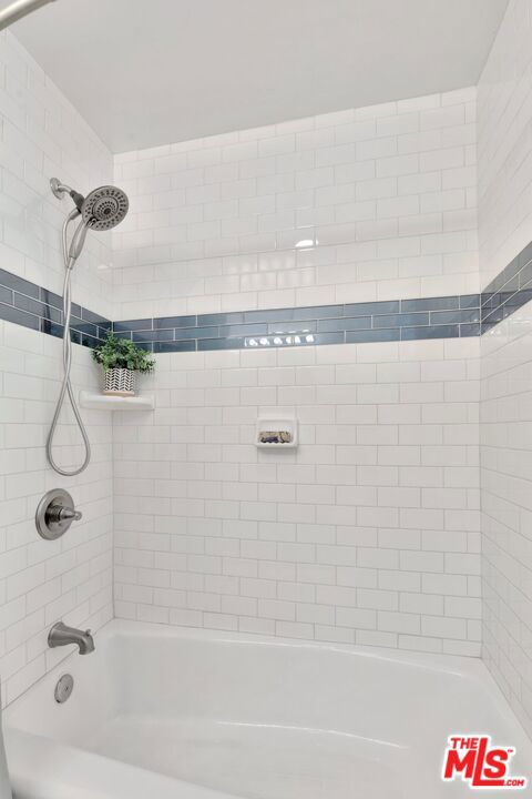 5372 Village Los Angeles, CA 90016 - Photo 14 of 28 a bathroom with a shower and a bath tub