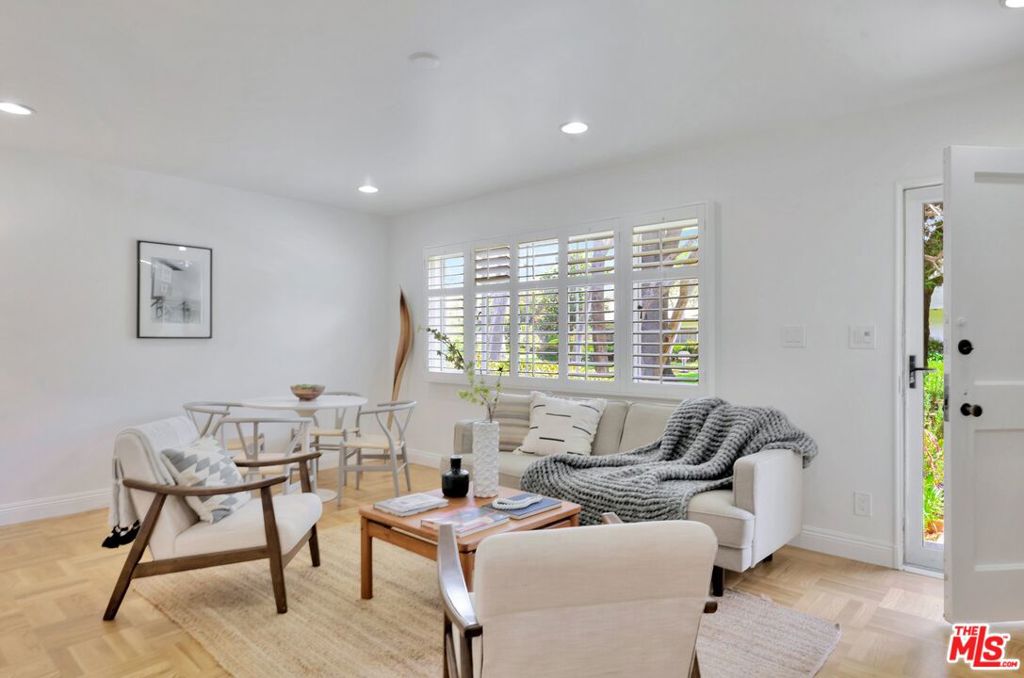 5372 Village Los Angeles, CA 90016 - Photo 3 of 28 a living room with furniture and a window