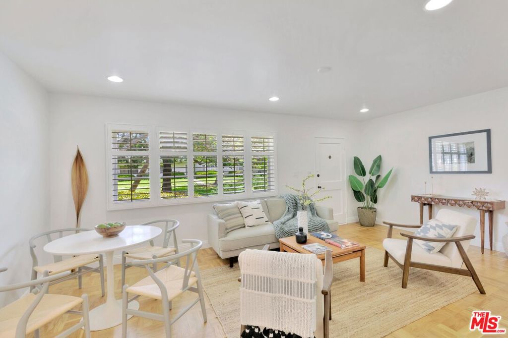 5372 Village Los Angeles, CA 90016 - Photo 4 of 28 a living room with furniture and a large window