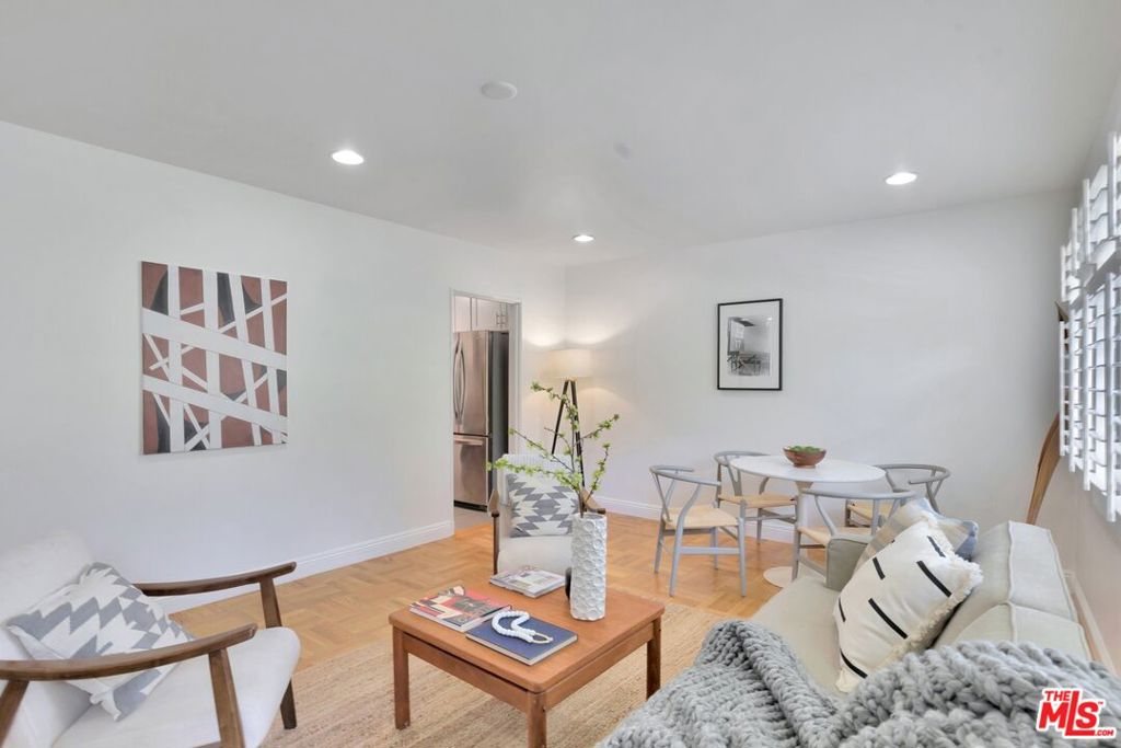 5372 Village Los Angeles, CA 90016 - Photo 5 of 28 a living room with furniture and wooden floor