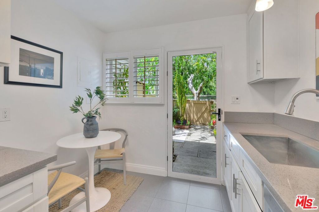 5372 Village Los Angeles, CA 90016 - Photo 8 of 28 a kitchen with a sink and cabinets