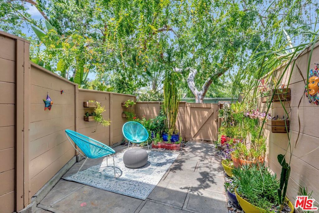 5372 Village Los Angeles, CA 90016 - Photo 9 of 28 a view of outdoor sitting area with furniture and wooden fence