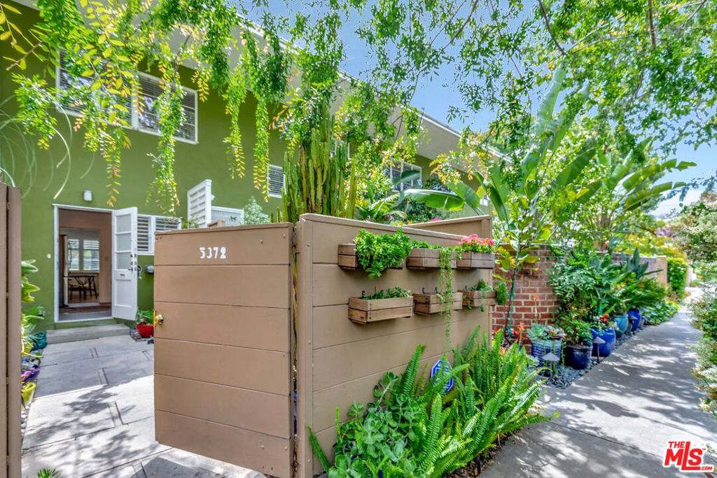 5372 Village Los Angeles, CA 90016 - Photo 10 of 28 a view of a white house with a sink and plants