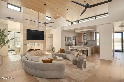 a living room with fireplace furniture and a flat screen tv