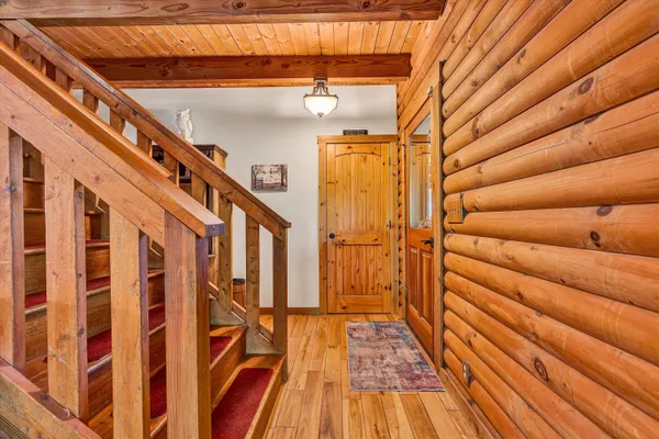 a view of entryway with wooden floor