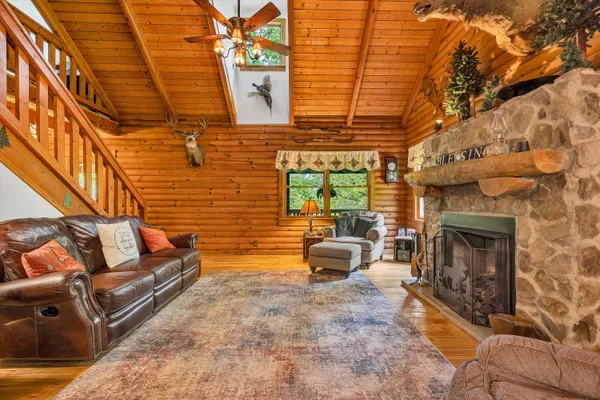 a outdoor living space with patio furniture and a fireplace