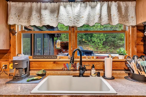 a bathroom with a sink a mirror and a shower