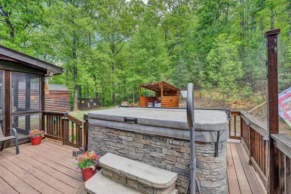 a backyard of a house with barbeque oven table and chairs