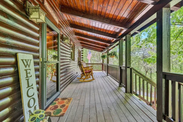 a view of balcony with wooden floor