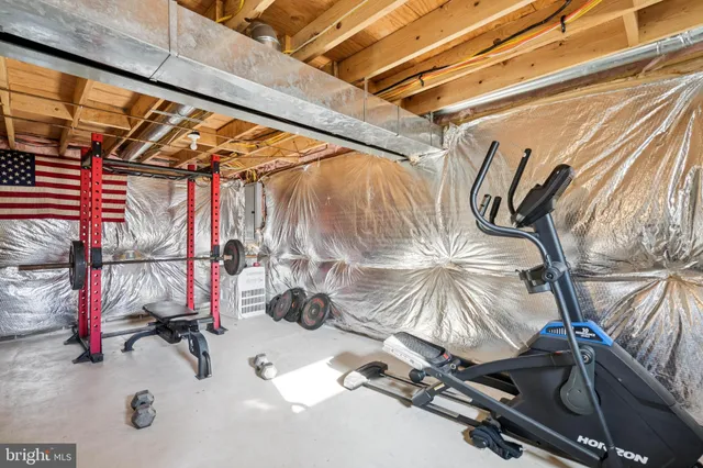 a view of a room with wooden floor and windows