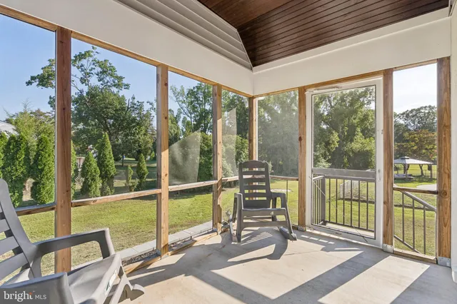 a view of a house with swimming pool and a yard