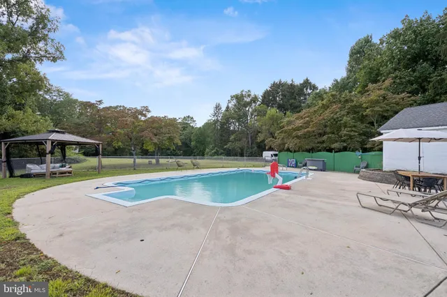 a view of a swimming pool with a patio