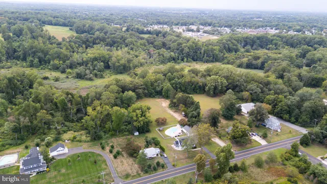 an aerial view of a house with outdoor space