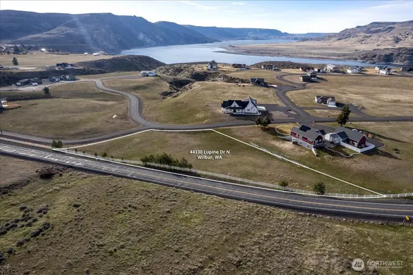 a view of a backyard with a table and chairs