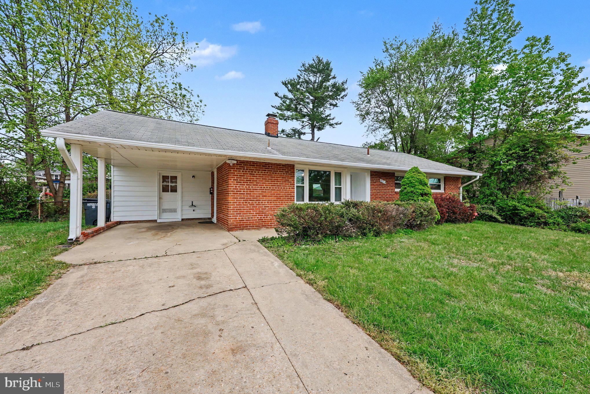 6714 Edsall Road Springfield, VA 22151 - Photo 13 of 16 Charming brick home with lush greenery.