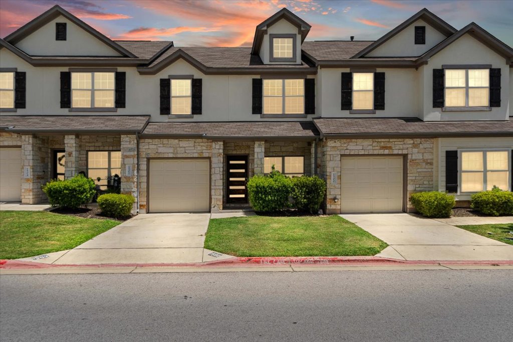 1502 Airedale Road, Unit 2502 Austin, TX 78748 - Photo 1 of 28 Stone and stucco exteriors with individual garages define these inviting townhomes.