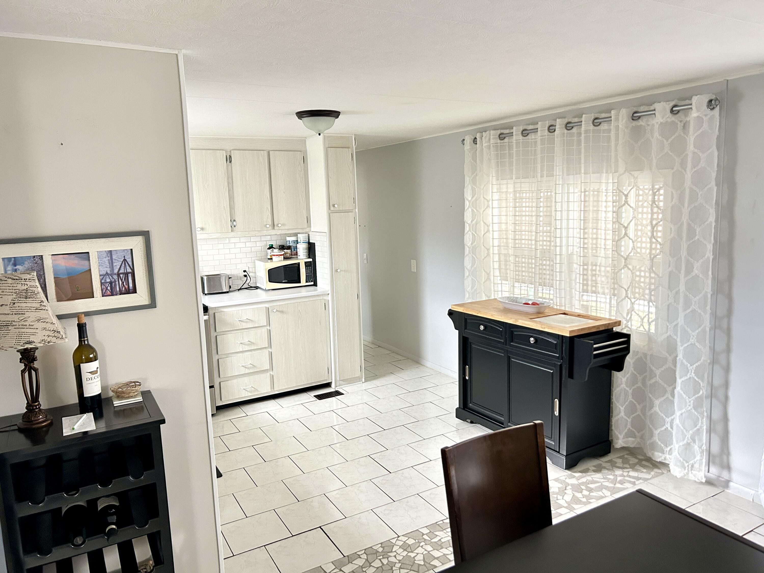 3240 State Street Hollywood, FL 33021 - Photo 12 of 29 a living room with furniture and a window