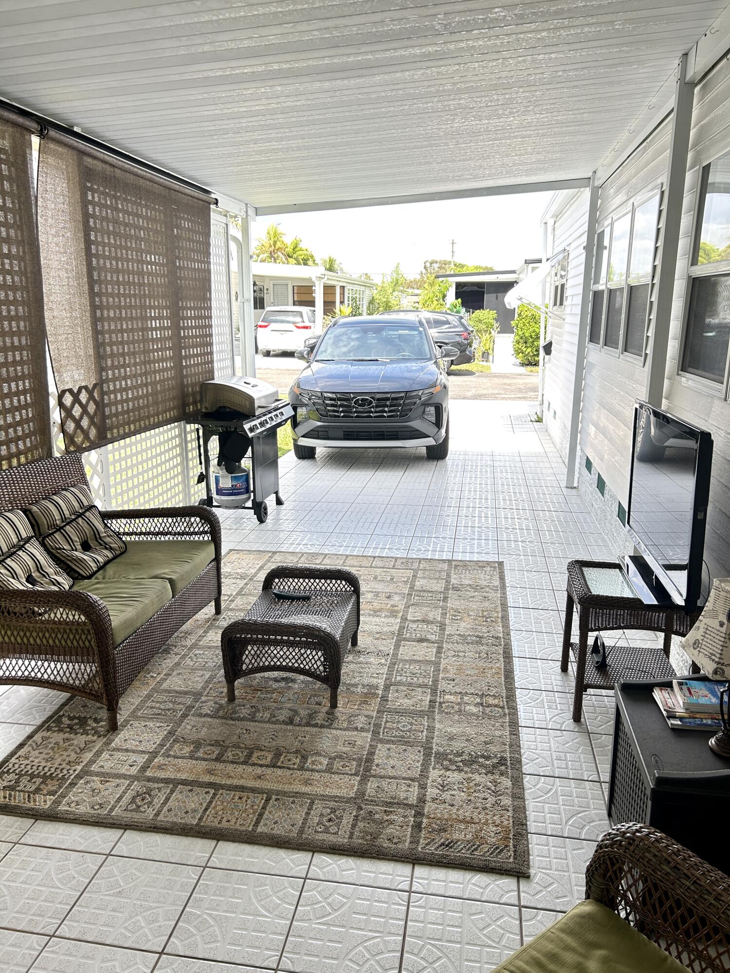 3240 State Street Hollywood, FL 33021 - Photo 18 of 29 a living room with furniture and a flat screen tv