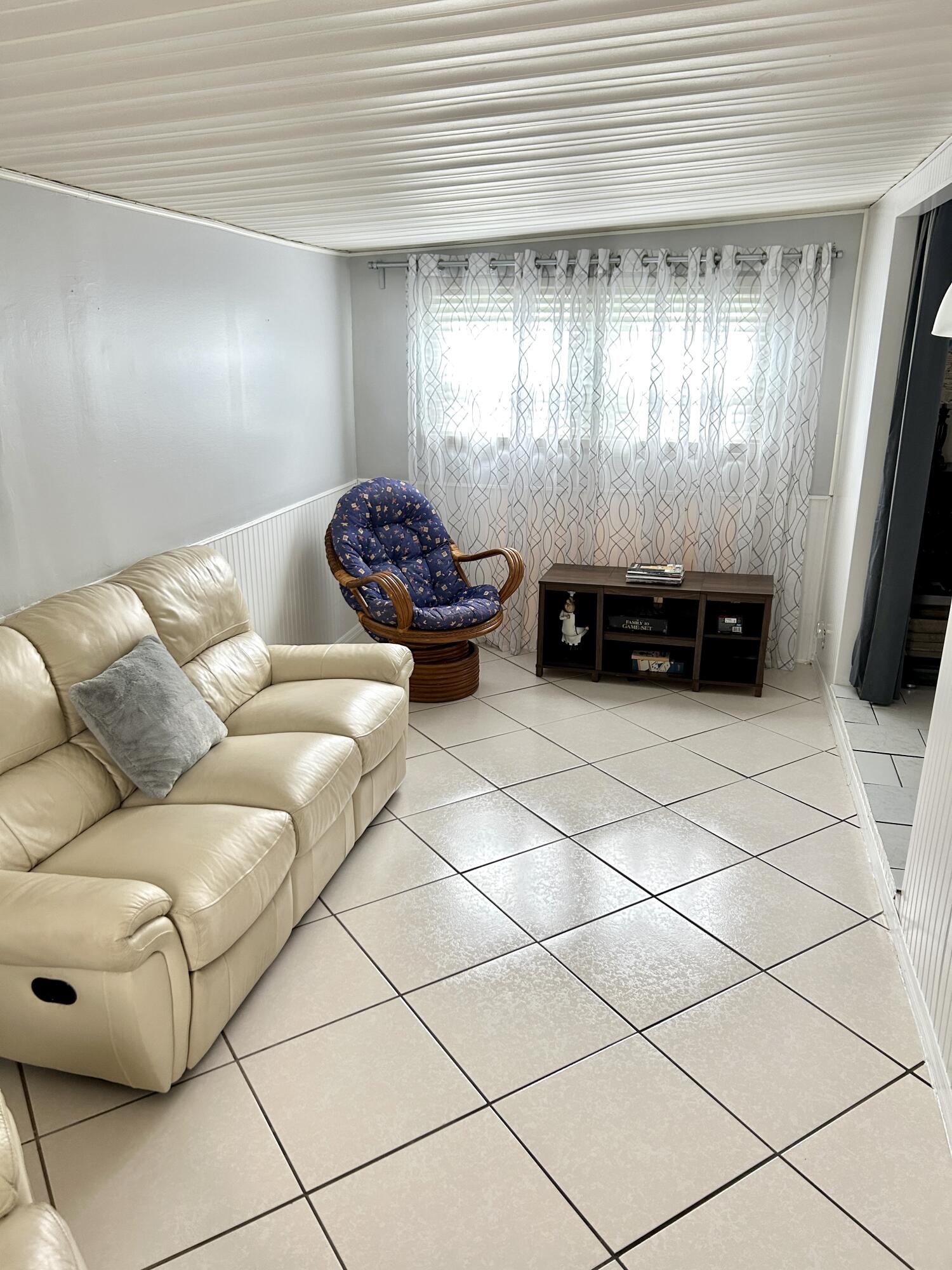 3240 State Street Hollywood, FL 33021 - Photo 22 of 29 a living room with furniture and a ceiling fan