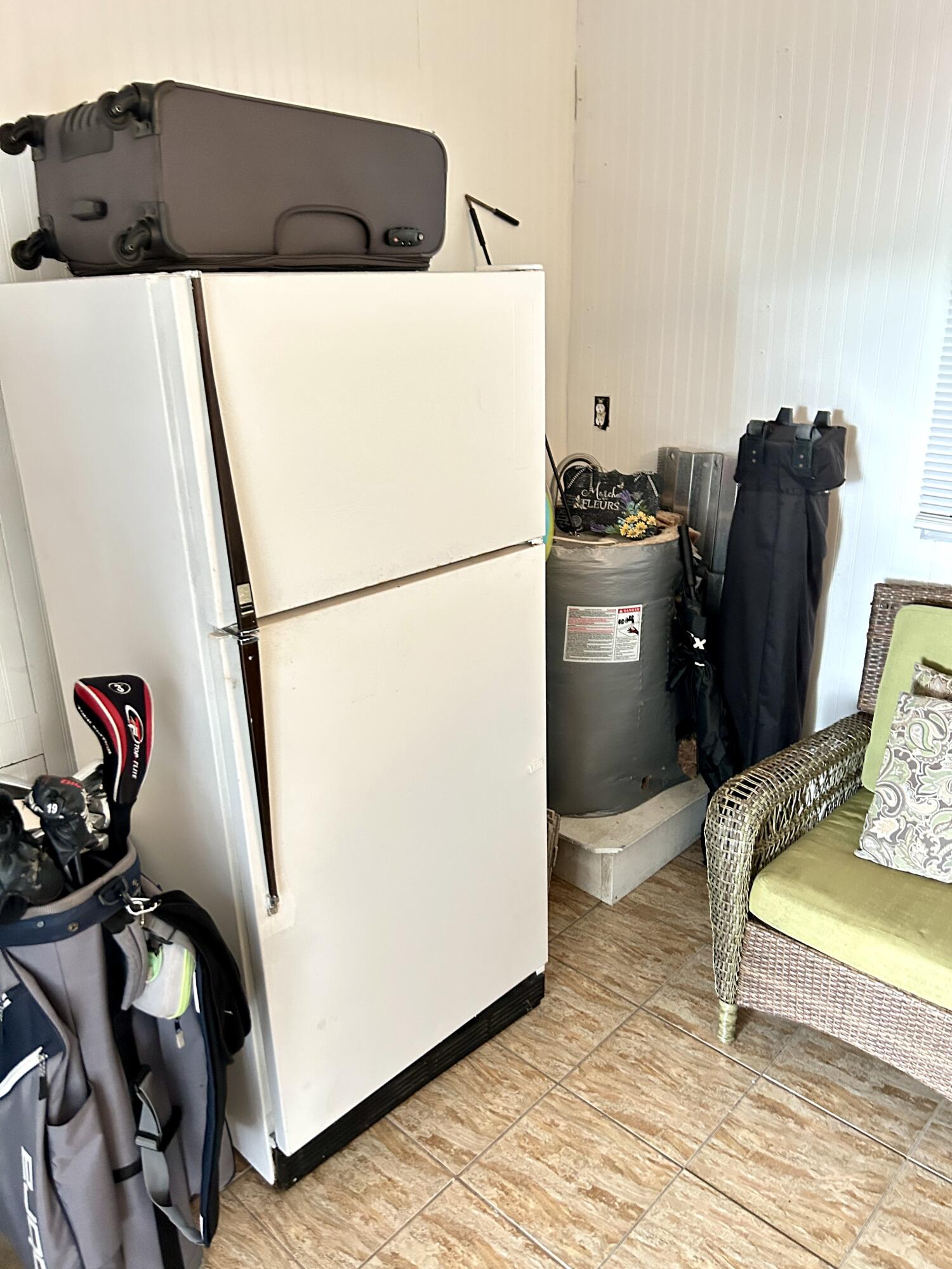 3240 State Street Hollywood, FL 33021 - Photo 24 of 29 a white refrigerator freezer sitting inside of a kitchen