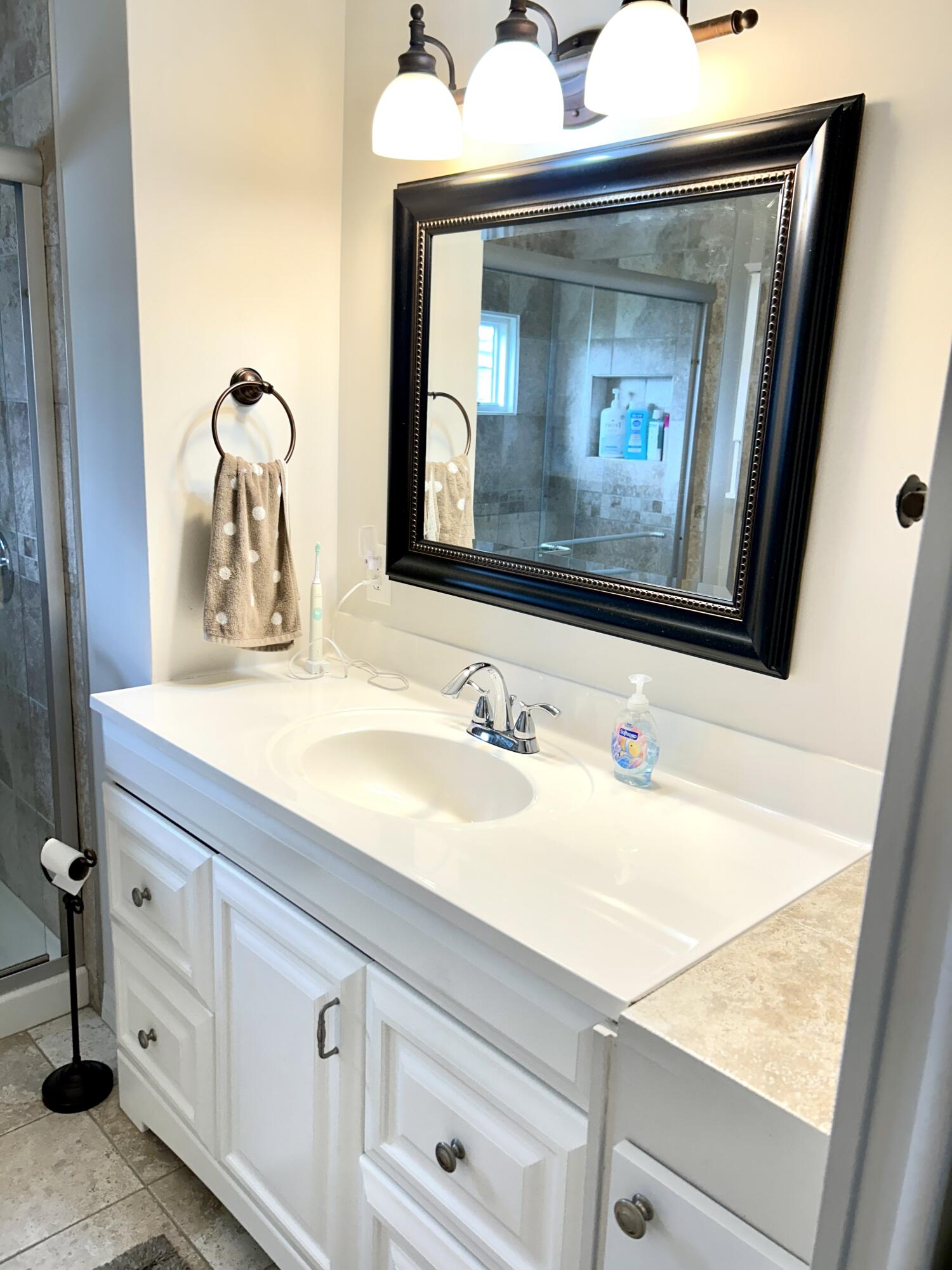 3240 State Street Hollywood, FL 33021 - Photo 7 of 29 a bathroom with a sink and a mirror