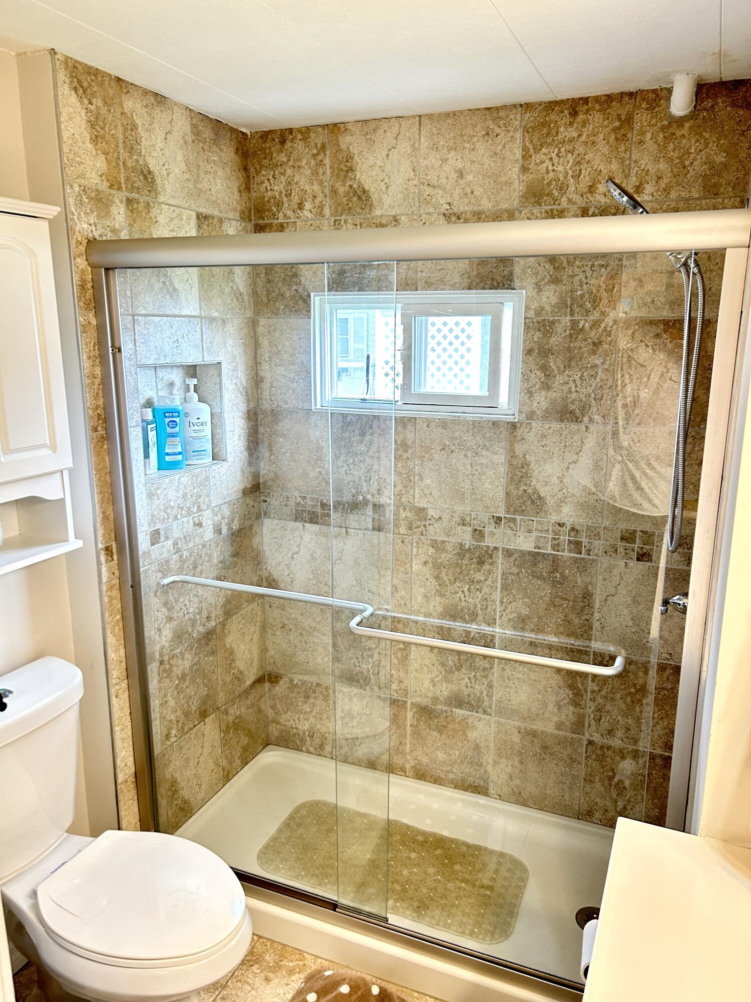 3240 State Street Hollywood, FL 33021 - Photo 8 of 29 a bathroom with a toilet and a shower