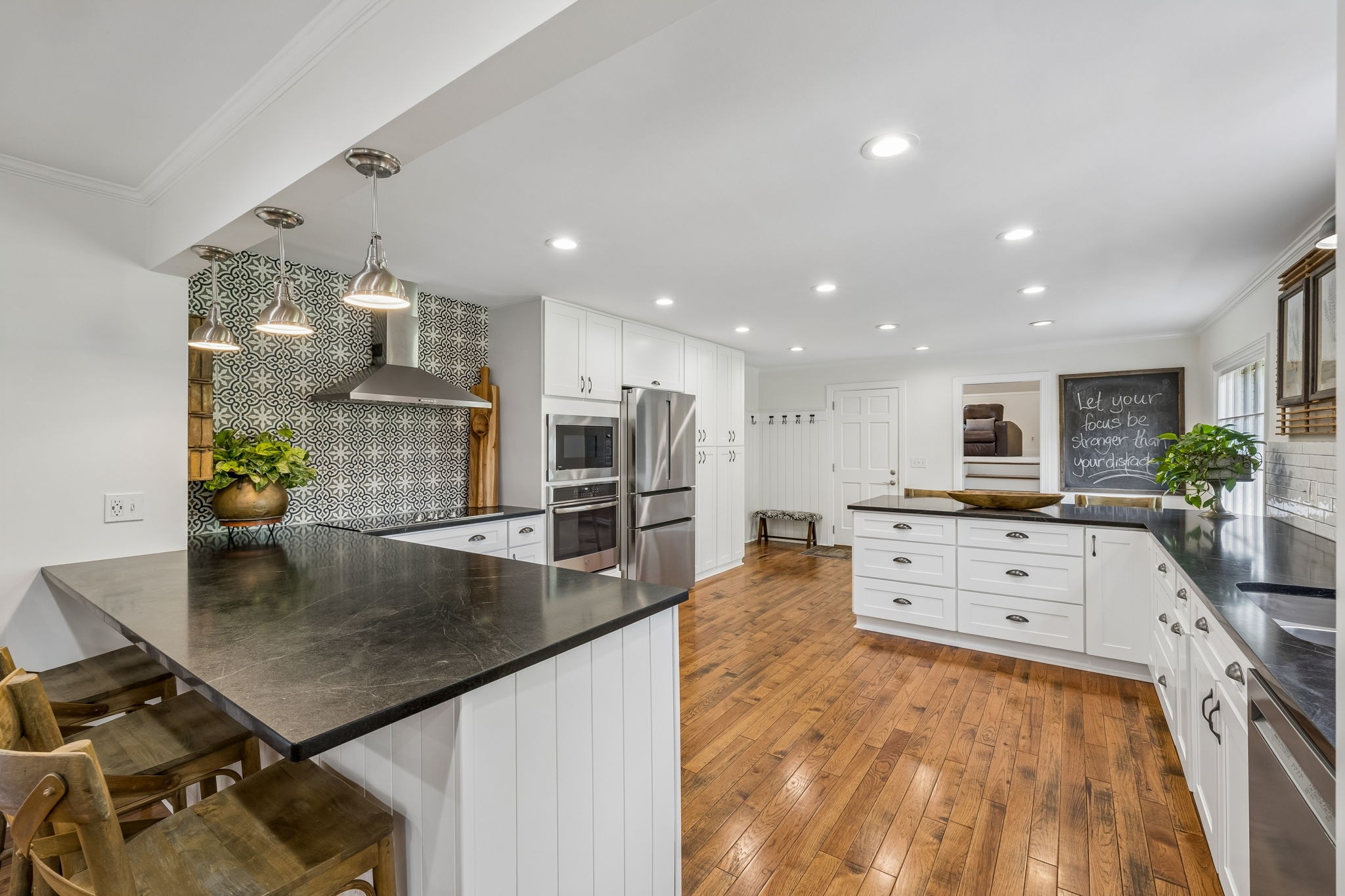 3007 Braintree Road Franklin, TN 37069 - Photo 16 of 71 a large kitchen with stainless steel appliances a large counter top a stove and a sink