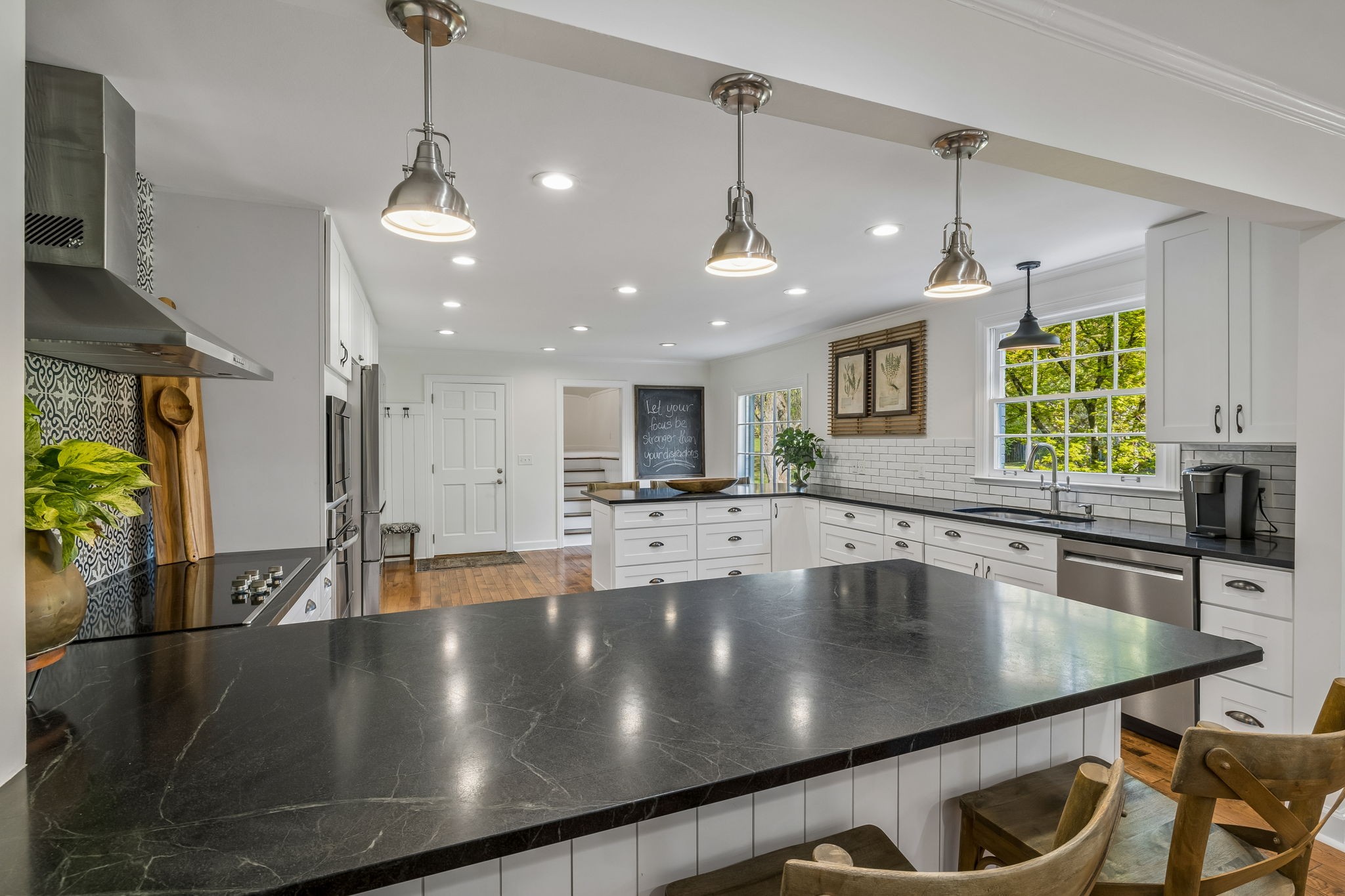 3007 Braintree Road Franklin, TN 37069 - Photo 17 of 71 a view of a kitchen counter top space a sink stainless steel appliances and living room view
