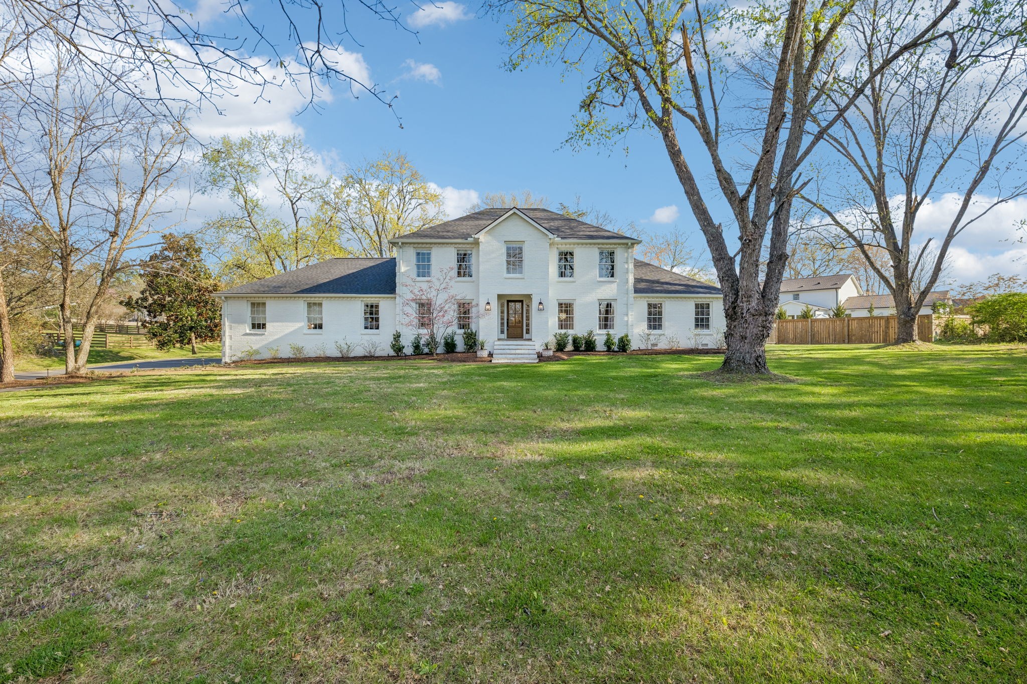 3007 Braintree Road Franklin, TN 37069 - Photo 2 of 71 a large white building with a big yard and large trees
