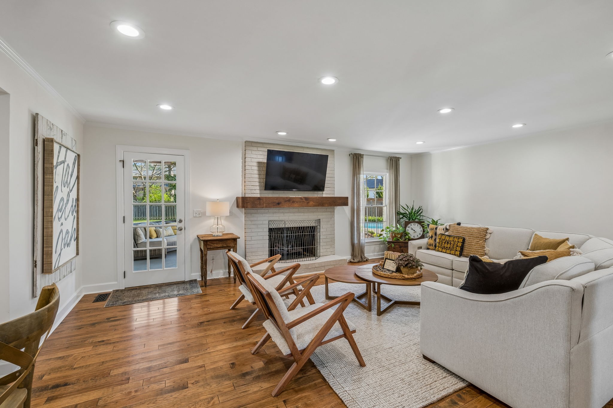 3007 Braintree Road Franklin, TN 37069 - Photo 6 of 71 a living room with furniture a fireplace and a flat screen tv
